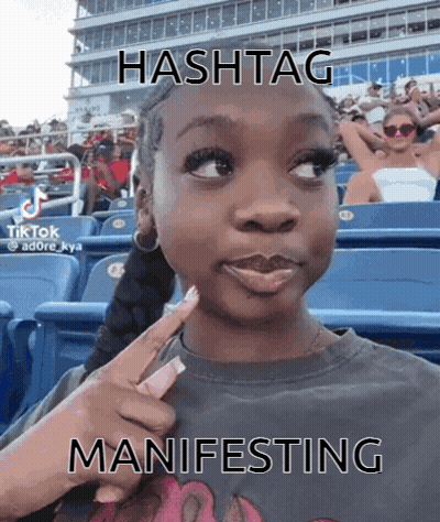 Girl In Stadium With Hashtag Manifesting GIF
