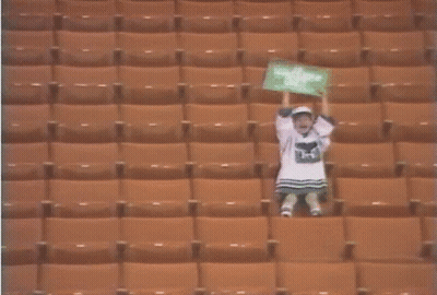 Girl In Stadium With I Love You Sign GIF