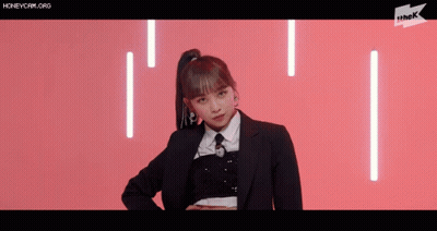Girl In Suit And Tie On Pink Background GIF