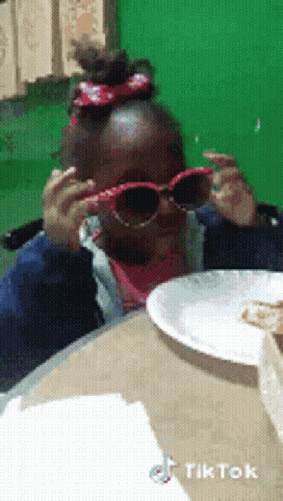 Girl In Sunglasses At Table With Food GIF