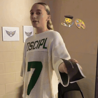 Girl In Sweater Saying Oscipl Holding Book GIF
