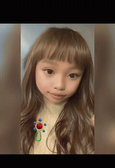 Girl in Sweater With Flower Brooch