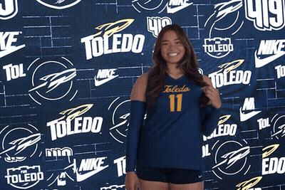 Girl In Toledo 11 Jersey In Front Of Nike Wall GIF
