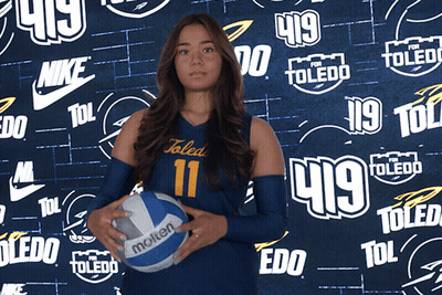 Girl In Toledo Uniform Holding Volleyball GIF