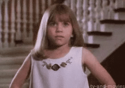 Girl In White Dress Standing By Stairs GIF
