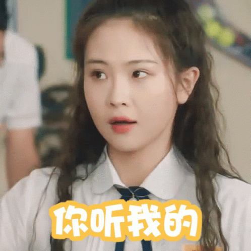Girl In White Shirt, Tie, And Chinese Writing GIF