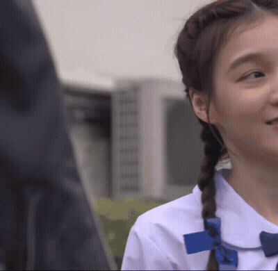 Girl In White Shirt With Blue Bow GIF