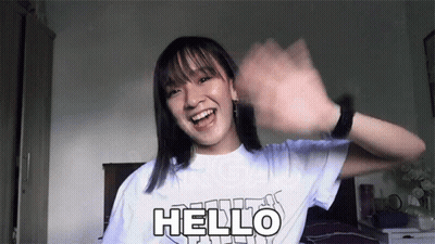Girl In White T-Shirt Saying Hello GIF
