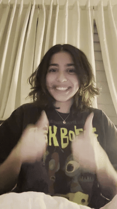 Girl in Xbox Shirt Giving Thumbs Up