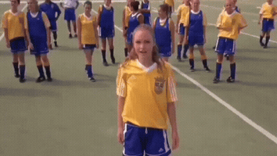 Girl In Yellow Adidas Shirt With Soccer Players GIF