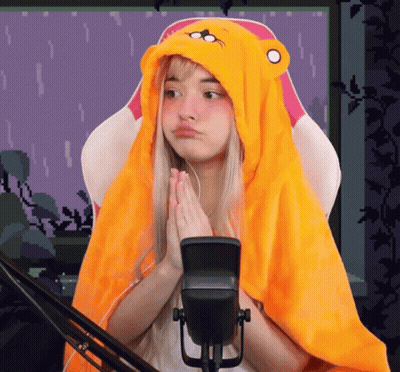 Girl In Yellow Hoodie Sitting At Microphone GIF
