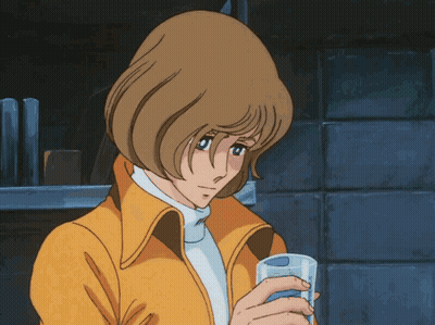 Girl In Yellow Jacket Holding Glass GIF