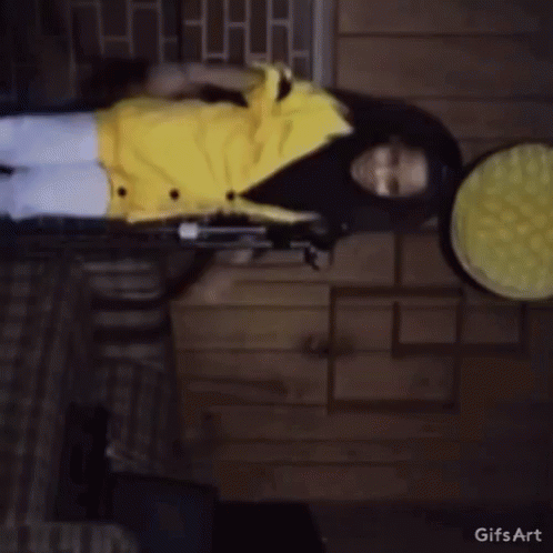 Girl In Yellow Jacket Standing GIF