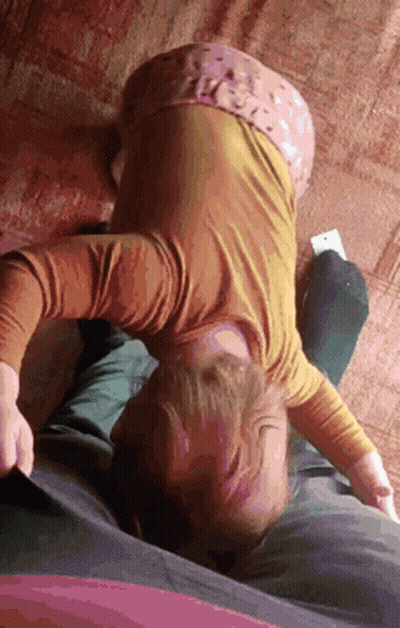 Girl In Yellow Shirt Lying On Couch GIF