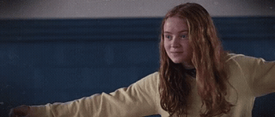 Girl In Yellow Sweater Hugging Blue Shirt Boy GIF