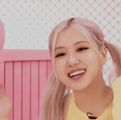 Girl In Yellow Sweater Smiling With Pigtails GIF