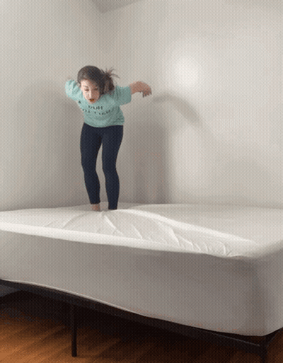 Girl Jumping On Bed With Push Shirt GIF
