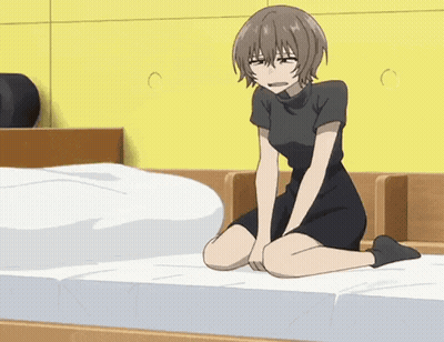 Girl Kneeling With Crossed Legs On Bed GIF