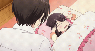 Girl Laying In Bed With Cherry Blossom Blanket GIF