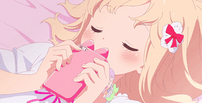 Girl Laying On Bed Looking At Phone GIF