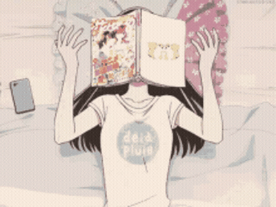 Girl Laying On Bed With Book Covering Face GIF