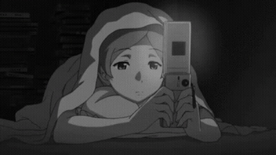 Girl Laying Under Blanket Looking At Cell Phone GIF
