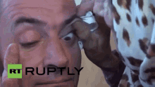 Girl Licking The Eyeball Of A Guy GIF