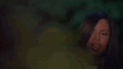 Girl Looking From The Bushes GIF