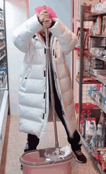 Girl Looking Unaccustomed To Cleaning GIF