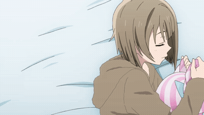 Girl Lying On Bed Holding Pink And Blue Pillow GIF