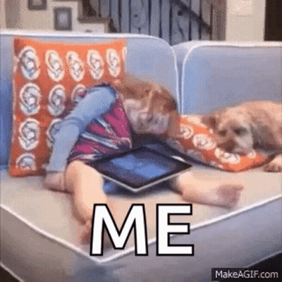 Girl Lying On Couch With Dog Using Tablet GIF