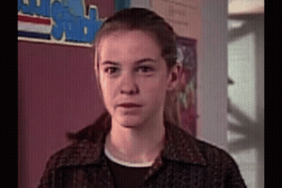 Girl Making Funny Face In Classroom GIF