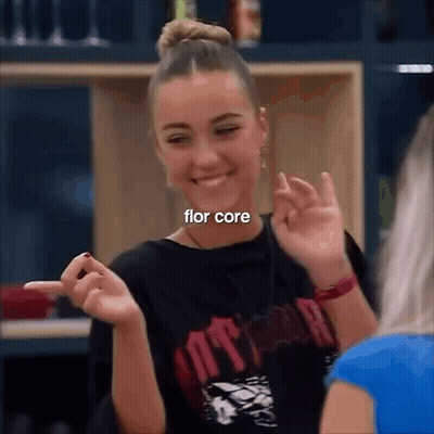 Girl Making Funny Face Pointing At Camera In Black Flor Core Shirt GIF