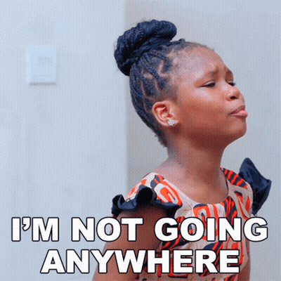 Girl Making Funny Face Saying I'm Not Going Anywhere GIF