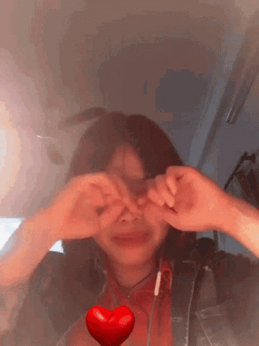 Girl Making Heart Shape With Hands GIF