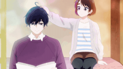 Girl Petting Boy's Head While He Reads GIF