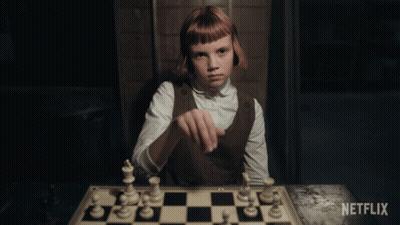 Girl Playing Chess With Netflix Logo GIF