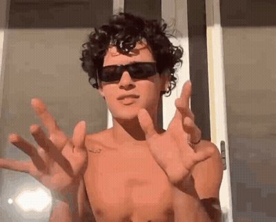 Girl Pointing At Boy's Face GIF