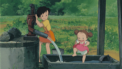 Girl Pumping Water From Well With Girl in Bucket