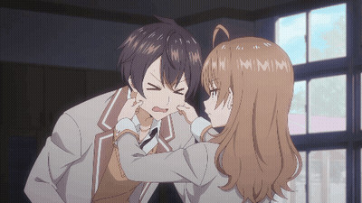 Girl Putting Fingers In Boy's Ear GIF