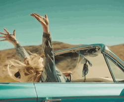 Girl Raising Hands On Road Trip GIF