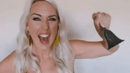 Girl Ringing Cowbell GIF