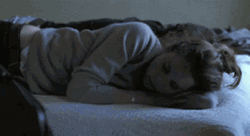 Girl Rolling And Snuggling With His Boyfriend GIF