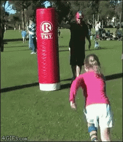 Girl Running In Front Of Red Punching Bag Saying R GIF