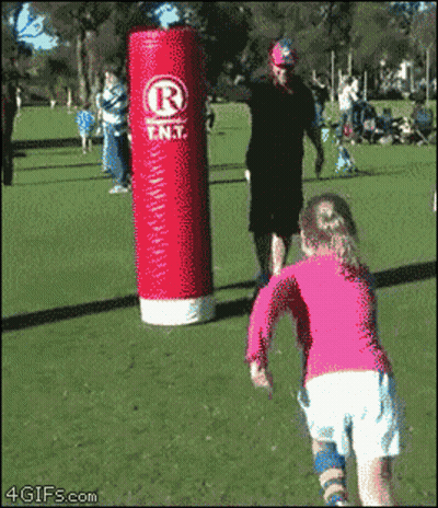 Girl Running Toward Red Punching Bag Saying Rent GIF