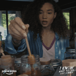 Girl Scooping Honey From The Jar GIF