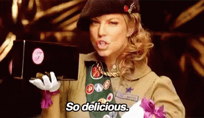 Girl Scout Holding Chocolates Saying So Delicious GIF