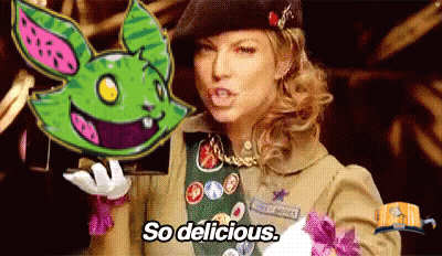 Girl Scout Holding Green Bunny Saying So Delicious GIF