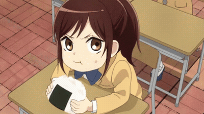 Girl Sitting At Desk Holding Rice Ball GIF