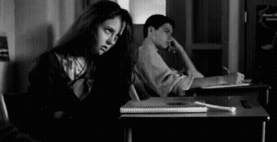 Girl Sitting At Desk Next To Boy GIF